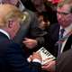 Image for article titled Donald Trump Signs an Issue of Playboy Featuring Himself on the Cover